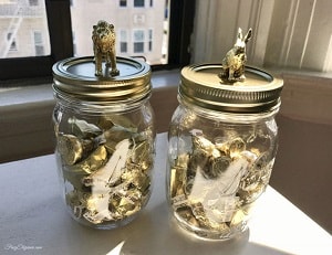 Glass candy jars with miniature gold animal cover
