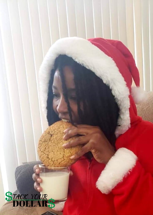 Eating oatmeal cookie in Santa outfit