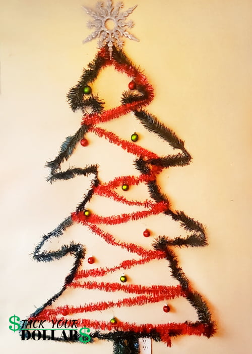 Christmas tree made with a garland on the wall