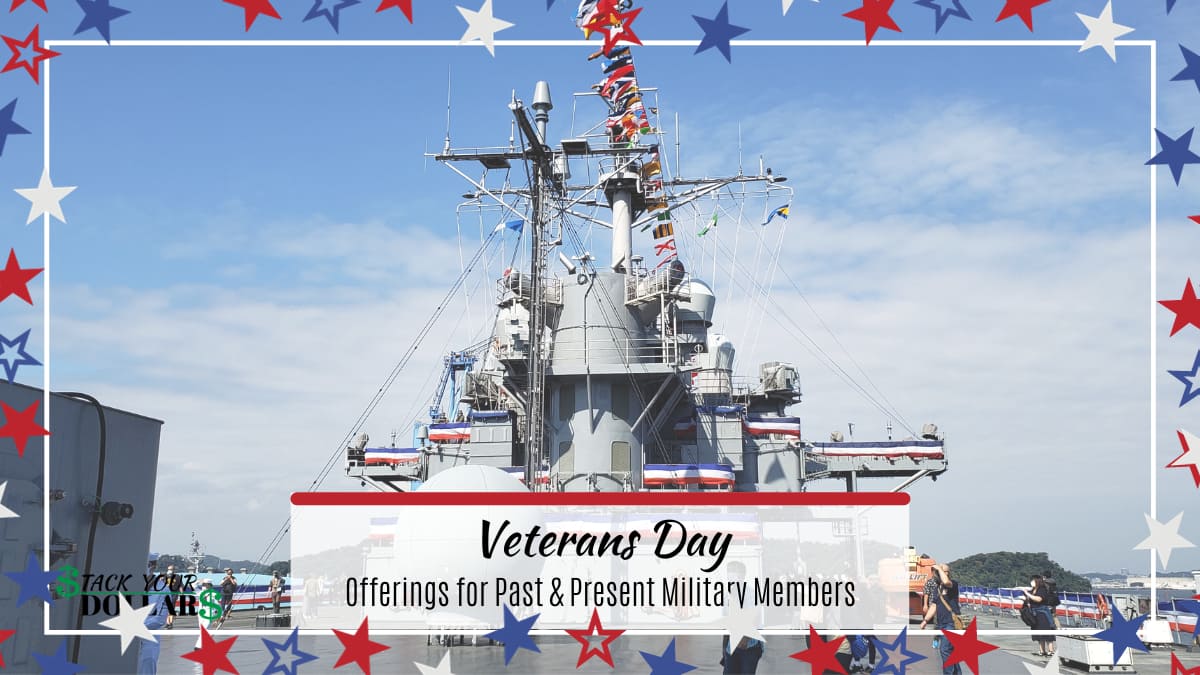 U.S. Navy Ship with flags, star banner and overlaid text: "Veterans Day"