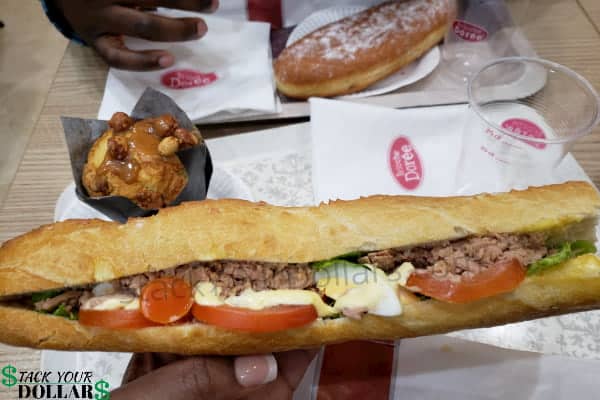 Image of a cheap meal in Paris, France. Sandwich, dessert, and drink.